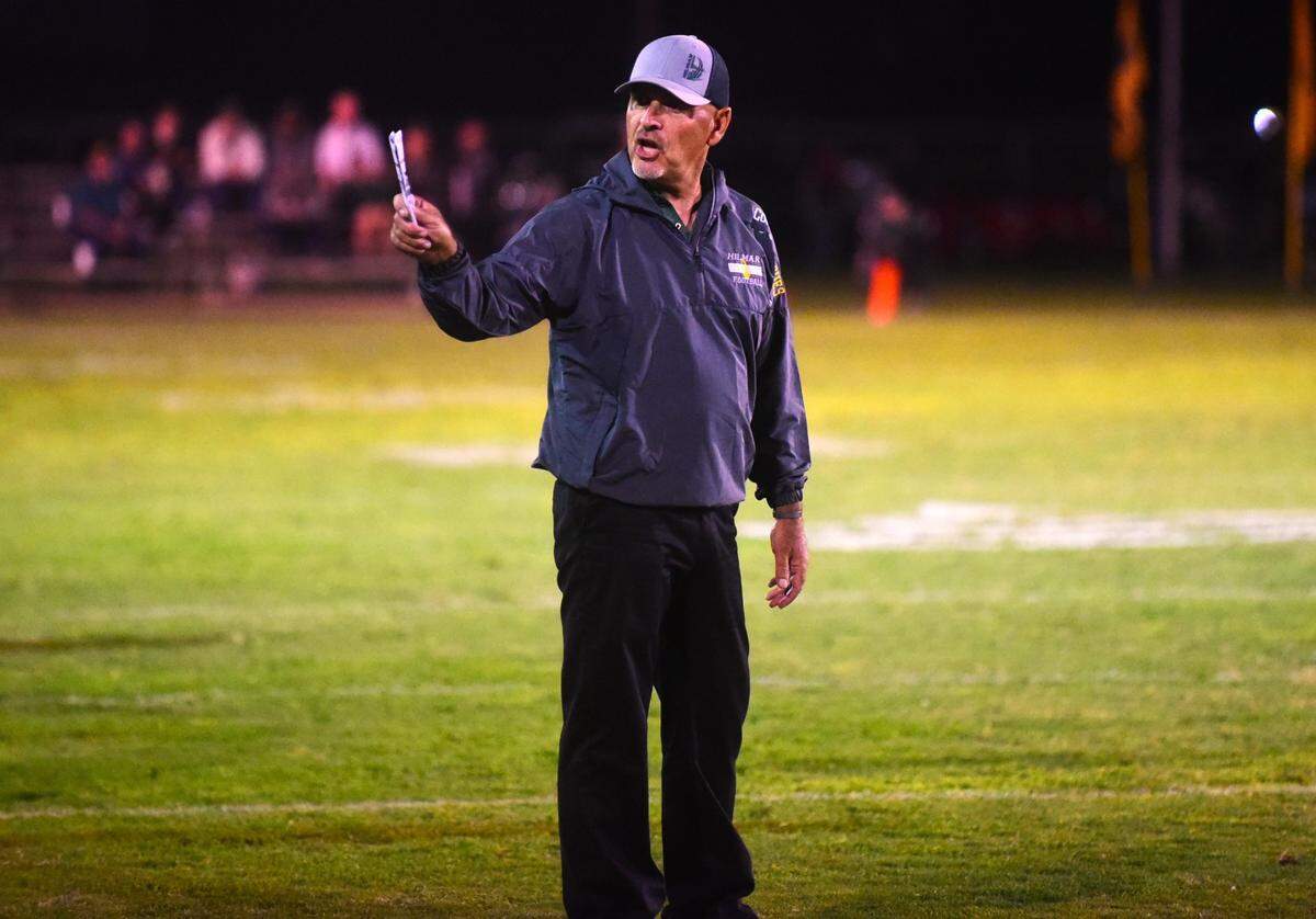 Hilmar High School head football coach Frank Marques motions to the Yellowjackets’ sideline during a 42-3 win over Livingston on Friday, Sept. 29, 2023.