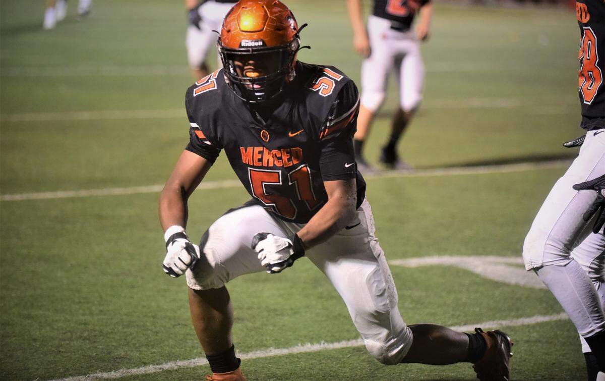 Merced senior Jaylen Thao-Booth celebrates one of his three sacks against Madera on Friday, Sept. 9, 2021 at Veteran Stadium in Merced, Calif.