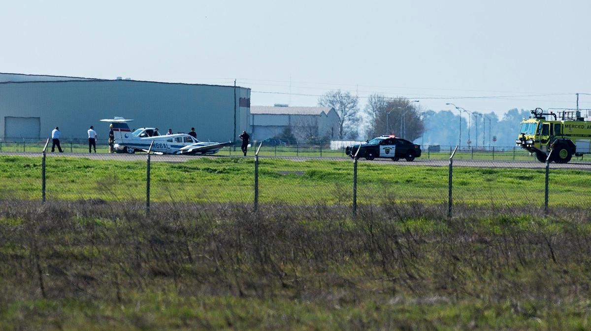 Emergency crews respond to Merced Regional Airport after a plane experienced a malfunction while landing in Merced, Calif., on Wednesday, Feb. 19, 2020. According to Merced Fire Department Battalion Chief Mickey Brunelli, it appears the plane experienced some sort of landing gear malfunction as it attempted to land at the airport.