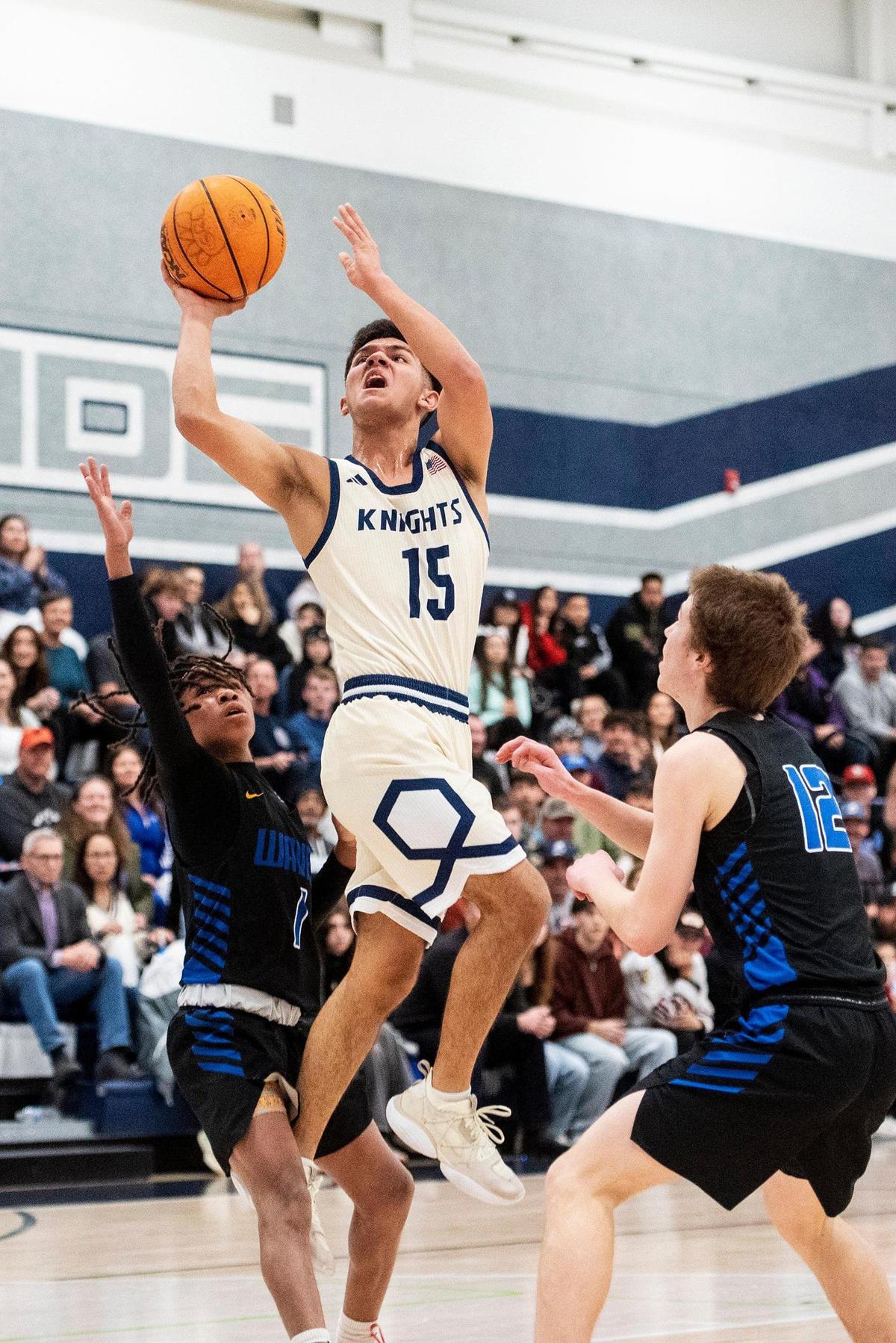 Stone Ridge Christian junior Kassius Salazar (15) attempts a layup during a CIF Sac-Joaquin Section Division 6 playoff game against Sacramento Waldorf at Stone Ridge Christian High School in Merced, Calif., on Tuesday, Feb. 20, 2024. The Knights beat the Wave 50-37.