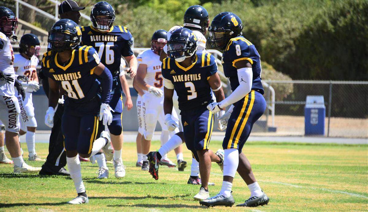 Merced College’s Isaiah Hidalgo (3) celebrates with teammates after catching a 17-yard touchdown in the second quarter against College of the Redwoods on Saturday, Sept. 3, 2022.