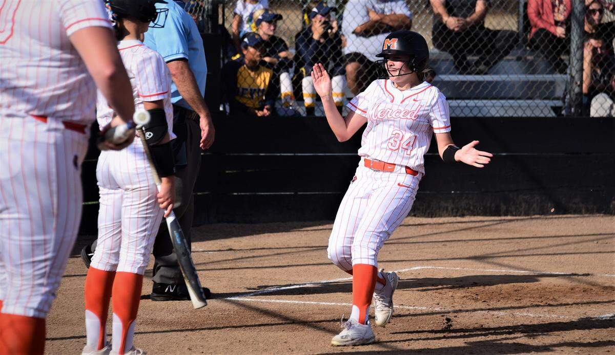 Merced High sophomore Aleatha Buchner celebrates after scoring a run during a 4-3 win over Golden Valley on Thursday, March 31, 2022 at Merced High School.