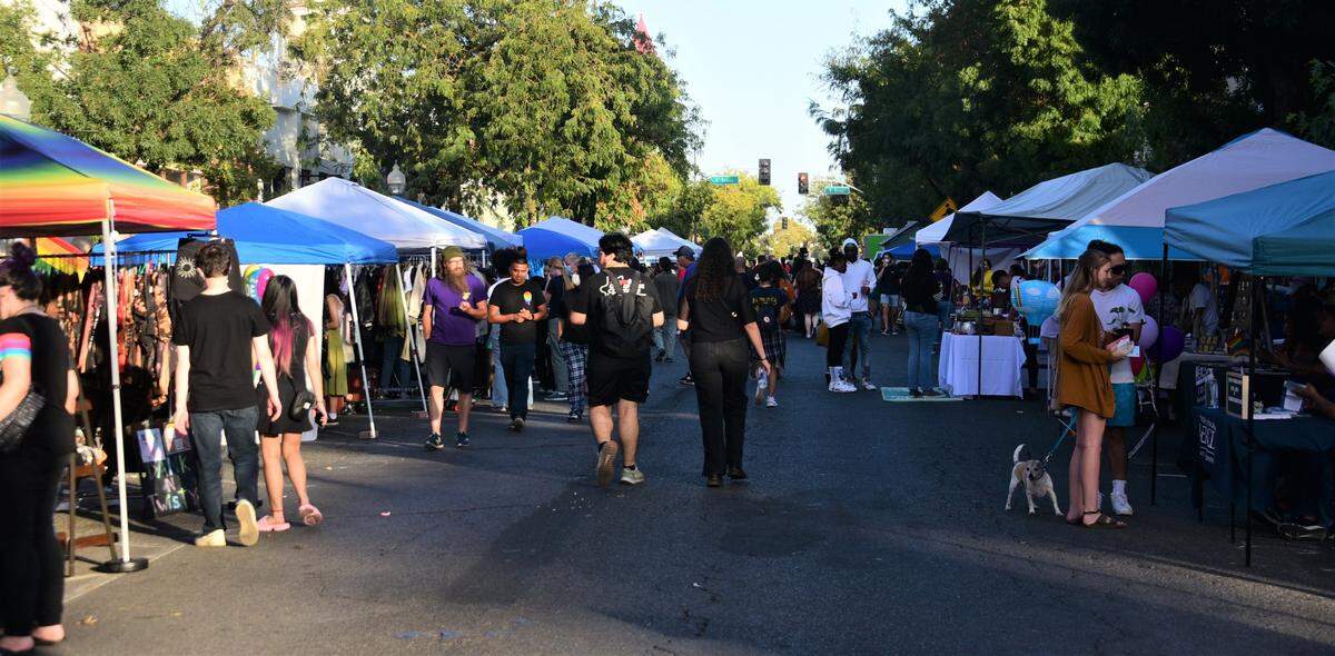 People walked up and down Main Street as 70 vendors lined Downtown Merced during Pride Fest on Saturday, Sept. 17, 2022.