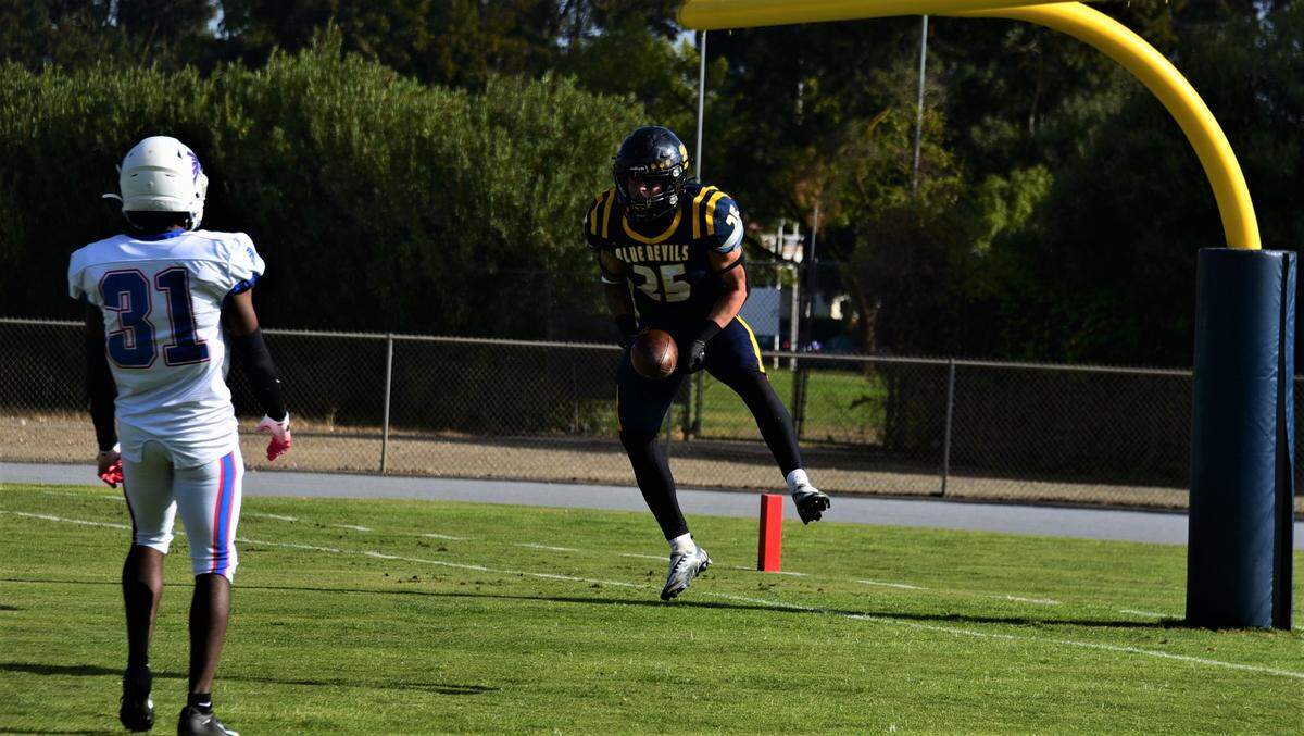 Merced College running back Justin Incaprera leaps after scoring a touchdown in the first quarter of a 41-14 win over West Hills Coalinga on Saturday, Nov. 12, 2022 at Stadium ’76.