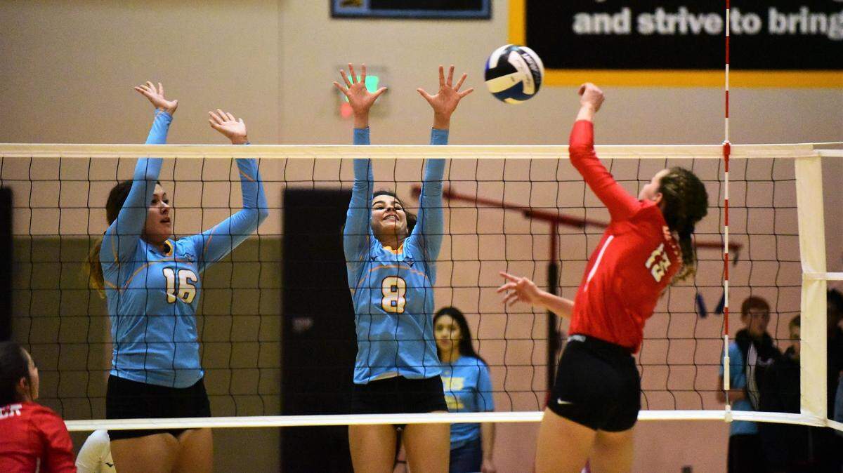 El Capitan’s Sierra Alvarez (16) and Yatzary Lua (8) go up to block the hit of Beyer’s Madeline Dibble during a playoff match on Tuesday, Oct. 29, 2019.