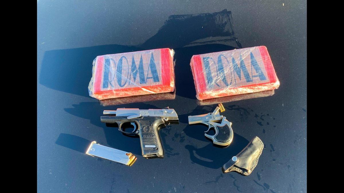 The driver of a 2013 Toyota Camry was arrested on Oct. 15, 2021, after a California Highway Patrol officer and CHP K-9 Bruce reportedly found two handguns and suspected cocaine inside the vehicle. Authorities said the officer stopped the car in the area of Interstate 5 and Russell Avenue for speeding. Image courtesy of California Highway Patrol.