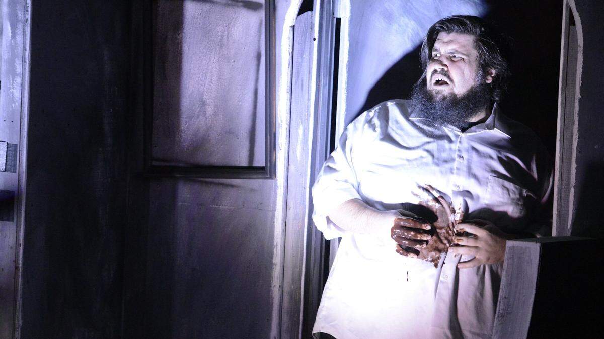 Harry Cooper, played by R.C. Essig, reacts to a gunshot wound from the play’s hero during a rehearsal of a live production based on George Romero’s classic “Night of the Living Dead” on Wednesday, Oct. 22, 2015. Playhouse Merced will participate in a national “Red Alert” event to help bring public awareness to the struggles of organizations that provide live entertainment due to the COVID-19 pandemic.