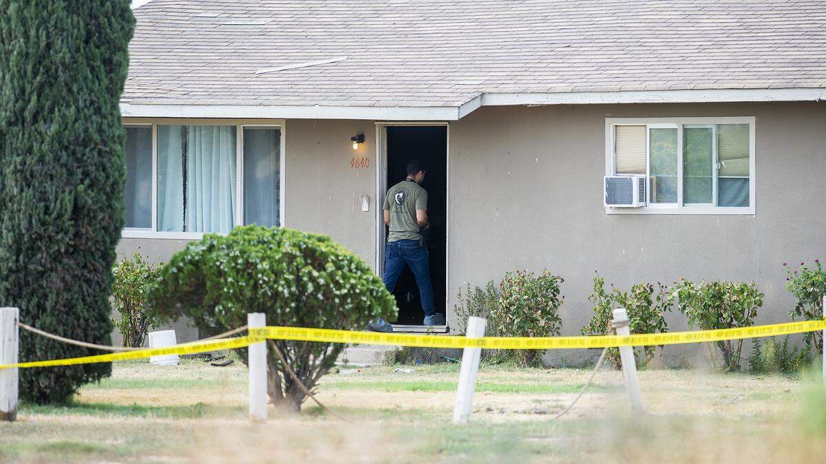 The Merced County Sheriff’s Office investigates the scene of a homicide after a woman was found dead with a gunshot wound at a residence in the 4600 block of Lingard Road in Merced County, Calif., on Sunday, Sept. 3, 2023.