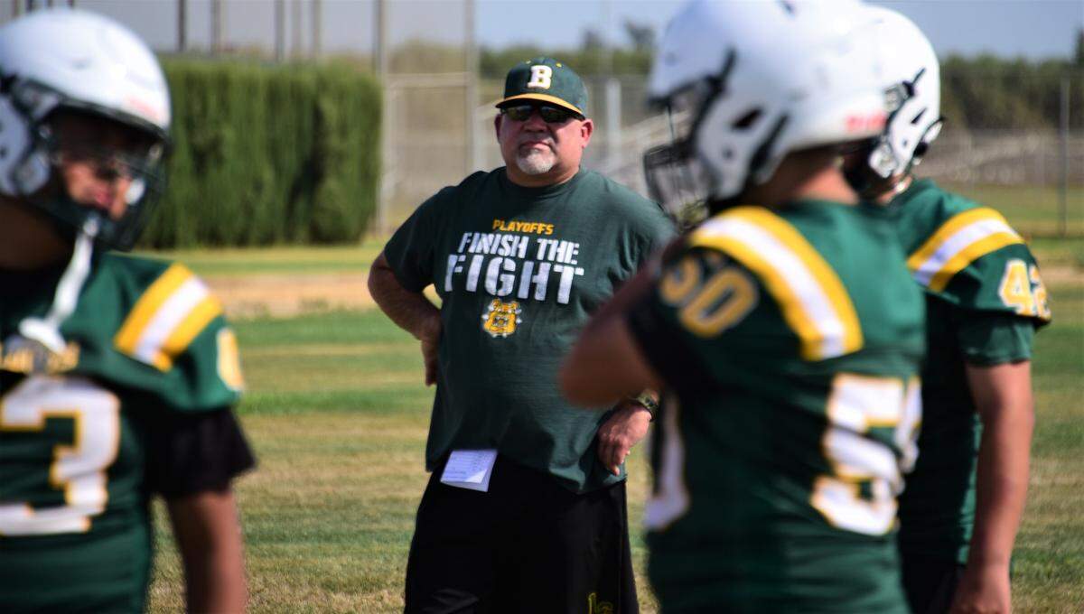Le Grand High School football head coach Aaron Martinez looks on during practice on Thursday, Aug. 10, 2023 in Le Grand, Calif.