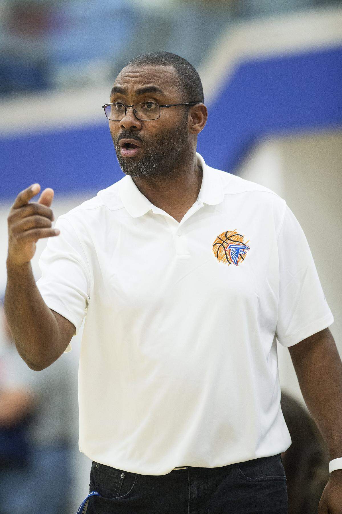 Atwater head coach Leonard Davis speaks to his players during a game against Buhach Colony at Atwater High School in Atwater, Calif., on Thursday, Jan. 17, 2019.