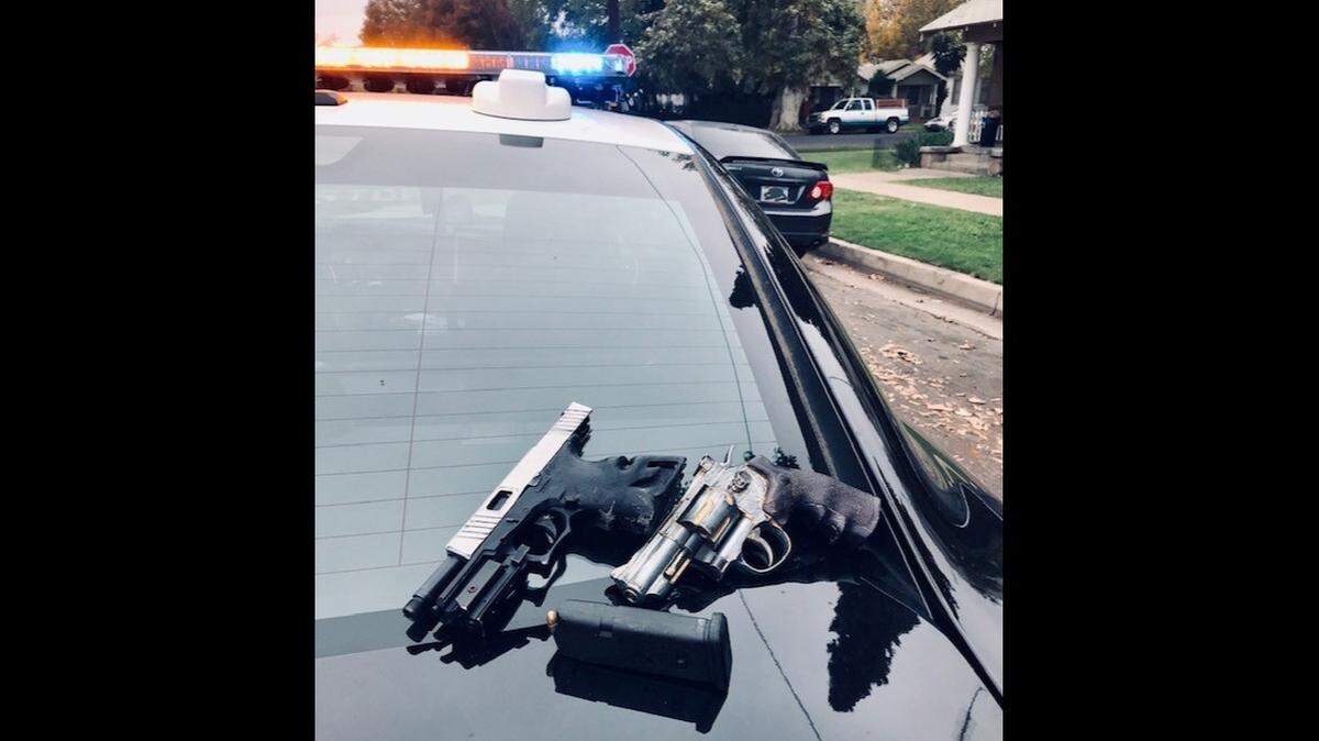 A 24-year-old suspect has been arrested after he was found inside a stolen vehicle on P Street in Merced, according to the Merced Police Department. Police said officers located a loaded 9mm gun and a replica revolver during a search of the vehicle. Image courtesy of Merced Police Department.