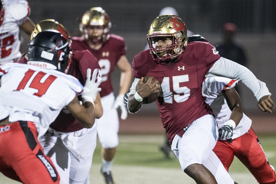 Golden Valley senior Davon Johnson (45) rushed the ball during a game against Cordova in the CIF Sac-Joaquin Section Playoffs at Golden Valley High School in Merced, Calif., on Friday, Nov. 2, 2018.