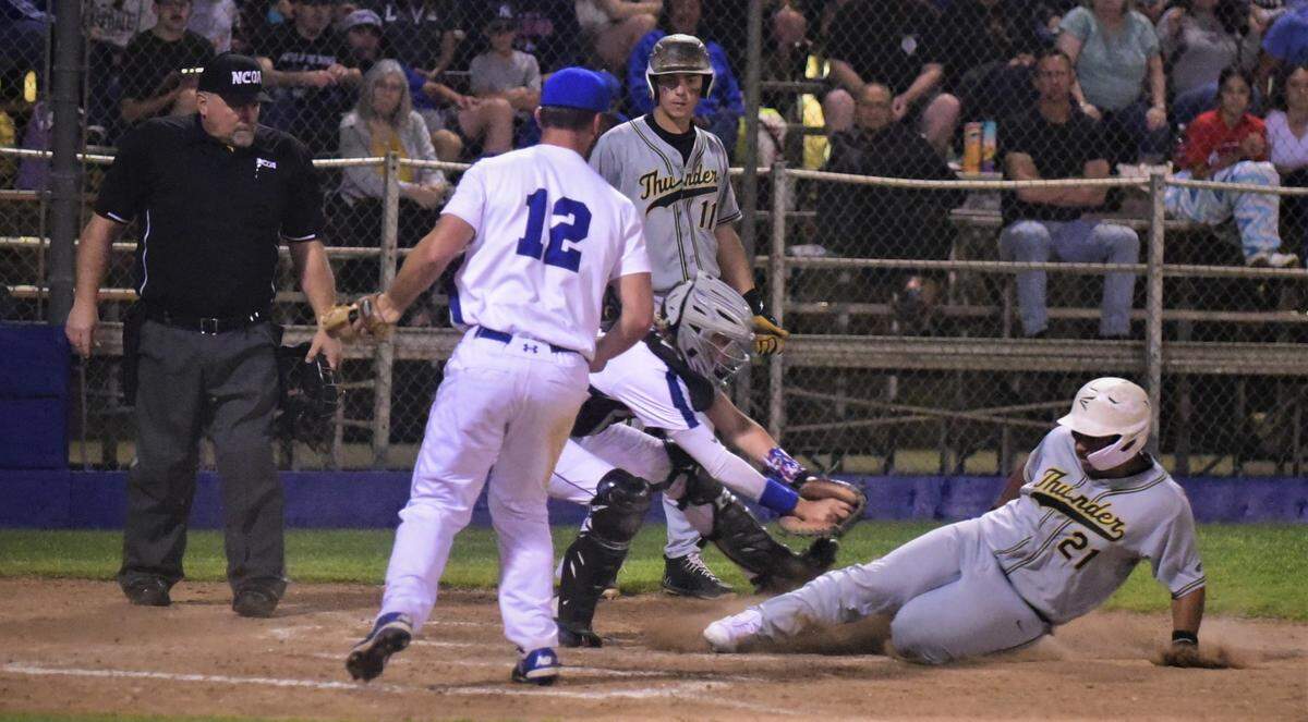 Buhach Colony’s Ramiro Jimenez is called out trying to score on a wild pitch as Atwater catcher Richard Menezes lunges to make a tag during a game on Friday, March 26, 2022 at Memorial Ballpark in Atwater, Calif.