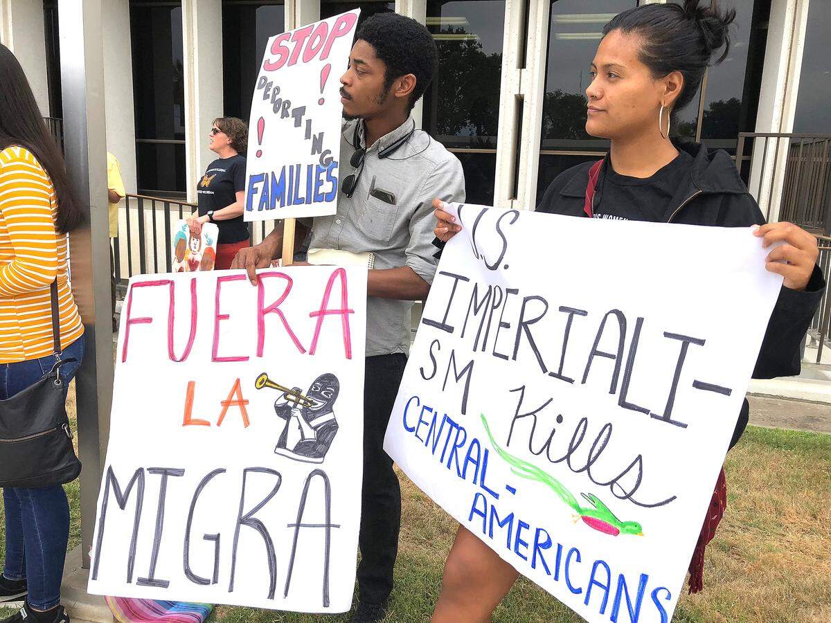 Supporters hold signs during a rally organized by Faith in the Valley in front of the Merced County building on Friday, June 28, 2019, in protest of inhumane living conditions of migrant children and fear in immigrant communities following President Donald Trump’s announcements on mass deportations.