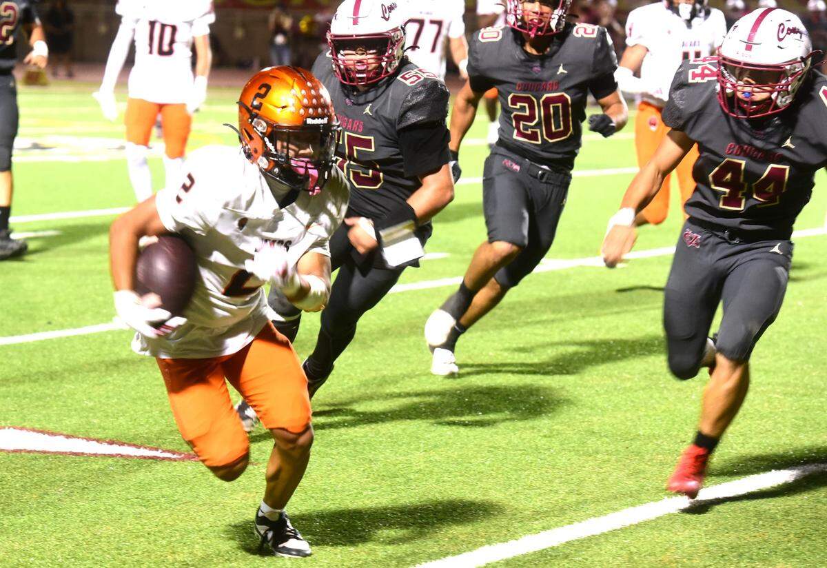 Merced High senior running back Adraius Morales-Saetern (2) runs the ball against Golden Valley during the Battle for the Mayor’s Cup on Friday, Oct. 4, 2024 at Veterans Stadium.