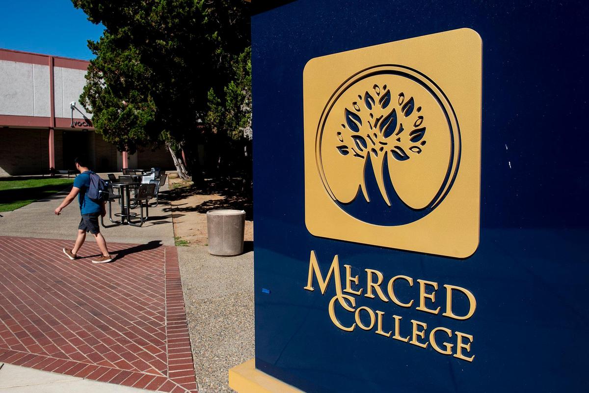 People walk across the campus of Merced College in Merced, Calif., on Thursday, Aug. 25, 2022.
