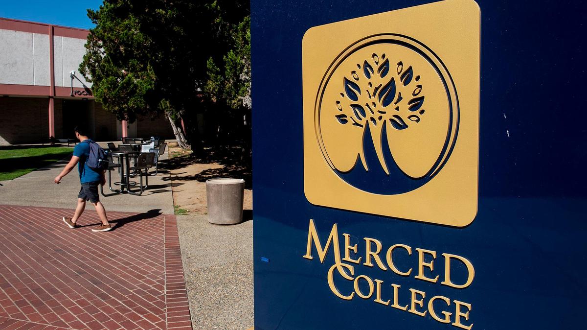 People walk across the campus of Merced College in Merced, Calif., on Thursday, Aug. 25, 2022.