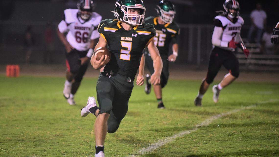 Hilmar running back Broc Perry runs the ball in a game against Modesto on Saturday, Sept. 4, 2021 at McSweeney Stadium at Hilmar High School.