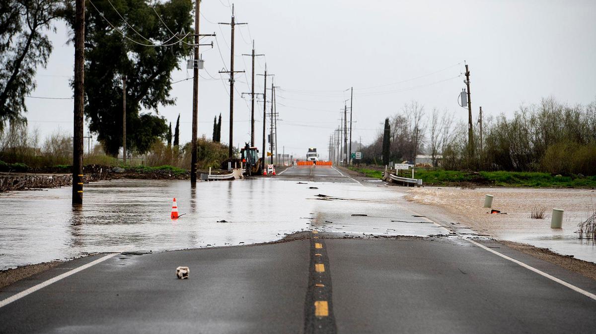 Floodwater flows over a section of Highway 59 between Reilly Road and McNamara Road in Merced County, Calif., on Sunday, March 12, 2023 in Merced, Calif., on Sunday, March 12, 2023.