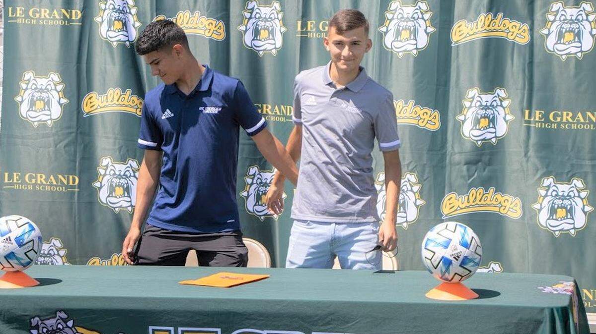 Le Grand High senior Brian Lua (right) poses for a photo with his older brother Andres during a recent signing ceremony at Le Grand High School. Biran will join Andres on the UC Merced men’s soccer team.