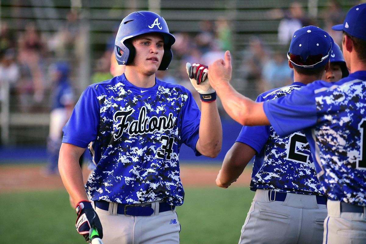 Atwater senior Jacob Faulk fist bumps teammates during the championship game against Mountain House in the annual Fran Oneto/Atwater-Winton Lions Easter Baseball Tournament at Memorial Ballpark in Atwater, Calif., on Thursday, April 25, 2019. The Falcons beat the Mustangs 8-1.