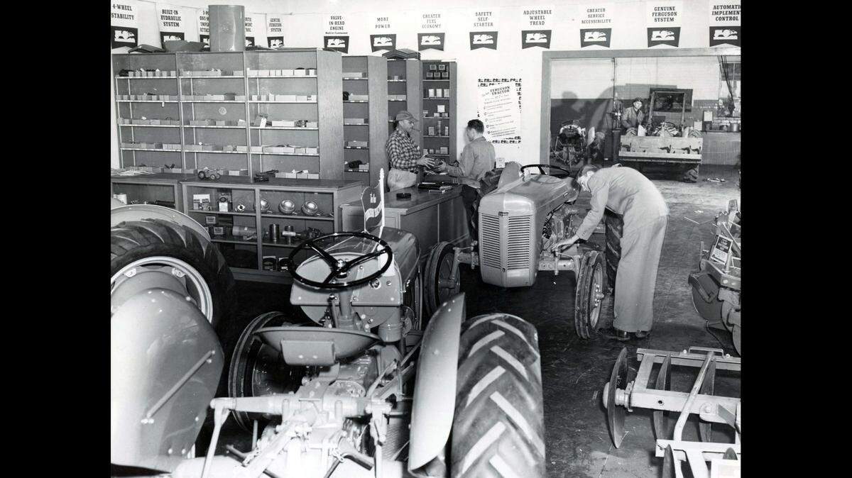 Bohn and Shipley Tractor was a Ferguson dealer. Started by Frank Bohn and Jack Shipley in 1950, it was located at 315 W. 16th Street in Merced. Cecil Anderson and Jackie Shipley are seen at the counter, 1950. (Barbara Levey Collection)