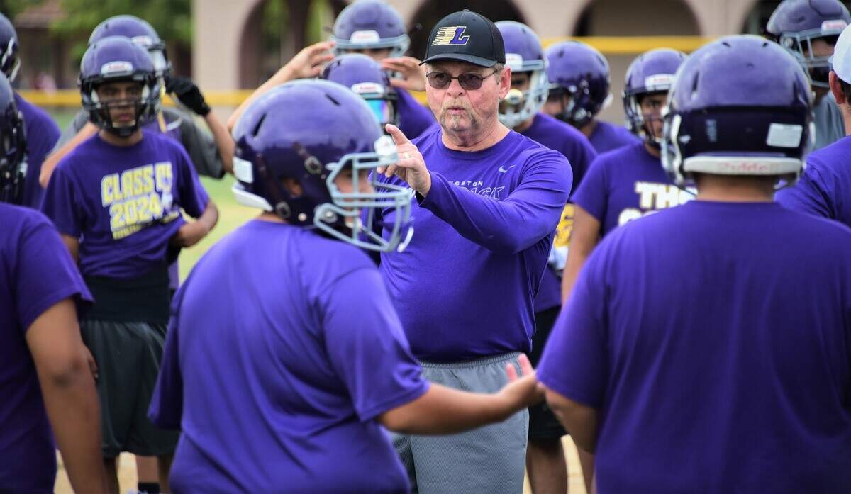 Scott Wine (center) joined the Livingston High football coach staff for the opportunity to coach with his sons Steven and Brian.