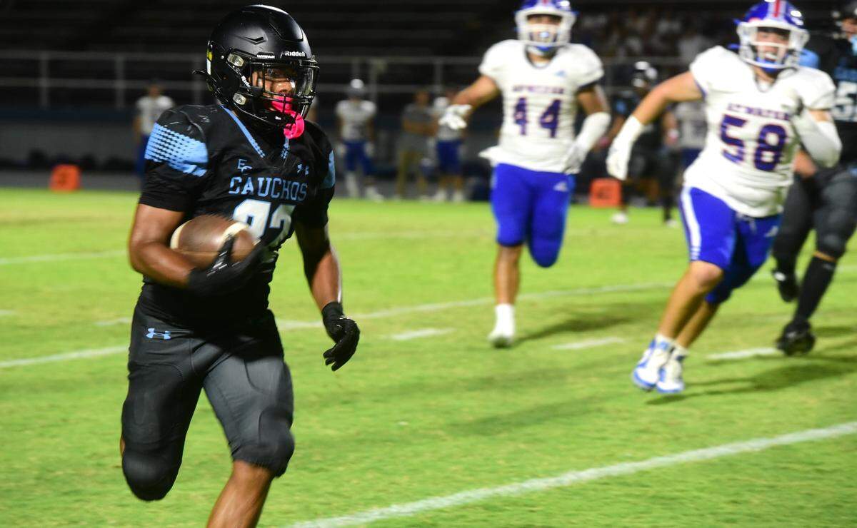 El Capitan High junior running back Lorenzo Peters (22) breaks free for a 43-yard touchdown run against Atwater on Friday, Oct. 11, 2024 at Stadium ’76.