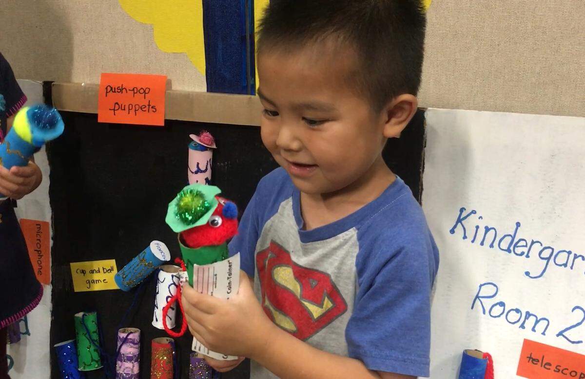 Students at Reyes Elementary in Merced enjoy playing games in a “cardboard arcade” created by other students at the school.