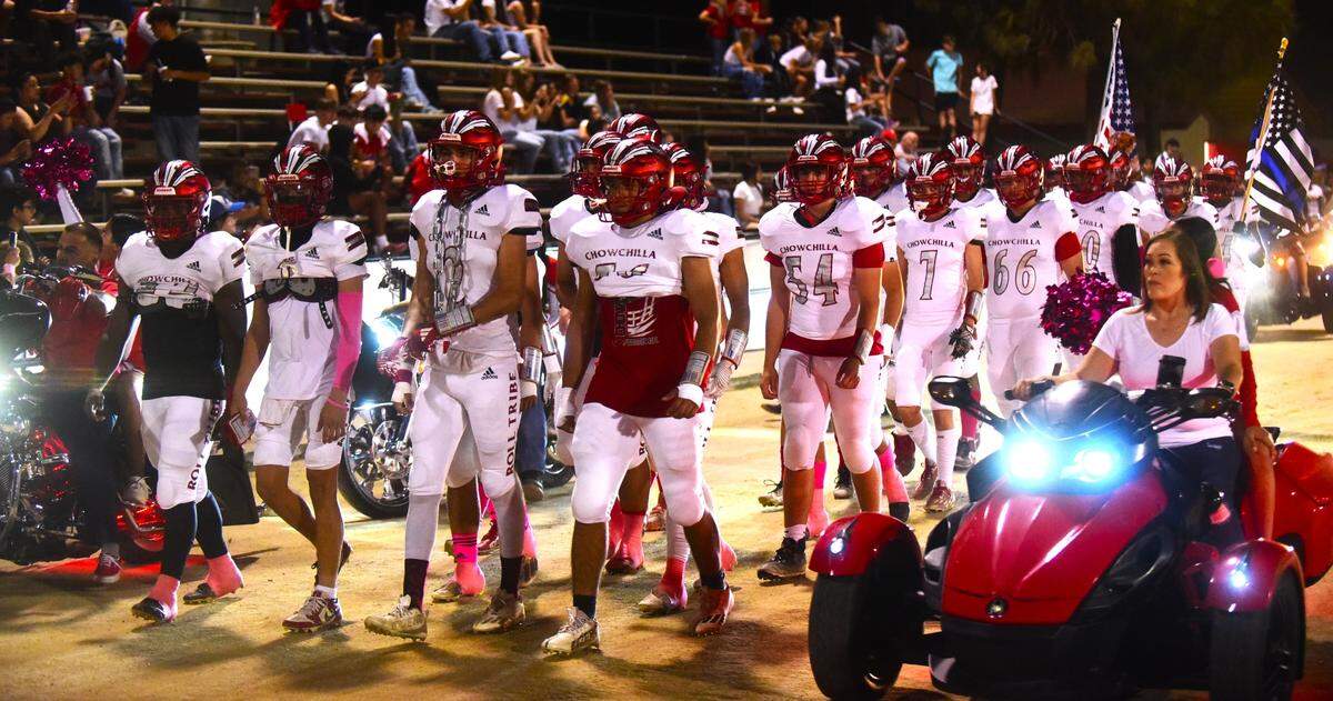 The Chowchilla High School football team is being escorted by a parade of motorcycles as they make their way to the field prior to a game against Caruthers on Friday, Oct. 20, 2023 in Chowchilla, Calif.