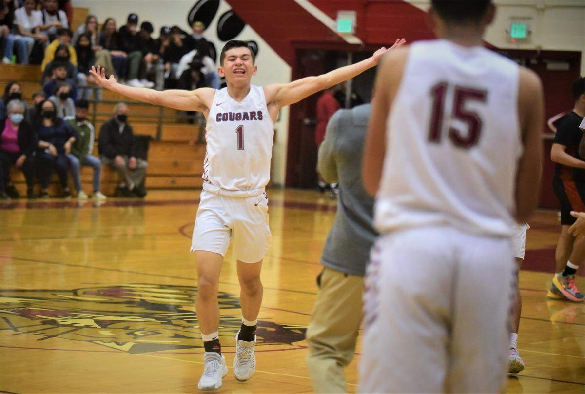 Golden Valley sophomore Richardo Perez celebrates as the Cougars stage a fourth-quarter comeback against Merced during a game at Cougar Arena on Friday, Feb. 11, 2022.