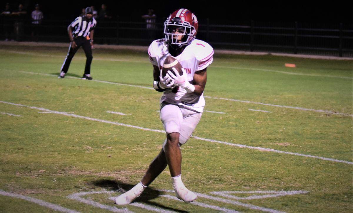Patterson High receiver Jeremiah Lugo hauls in a 30-yard touchdown catch in the first half during a 24-21 win at Merced on Friday, Sept. 23, 2022.