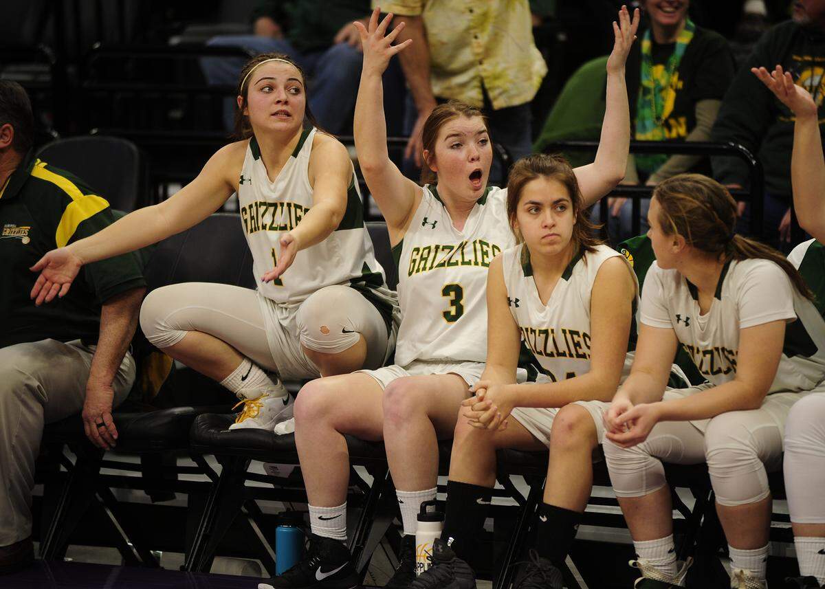 The Mariposa bench urges the crowd to get up, during the Mariposa High vs Argonaut Sac-Joaquin Section Division V Championship at Golden 1 Center in Sacramento, on February 23, 2019. Despite a fourth quarter effort to comeback, the Mariposa Grizzlies lost to Argonaut.