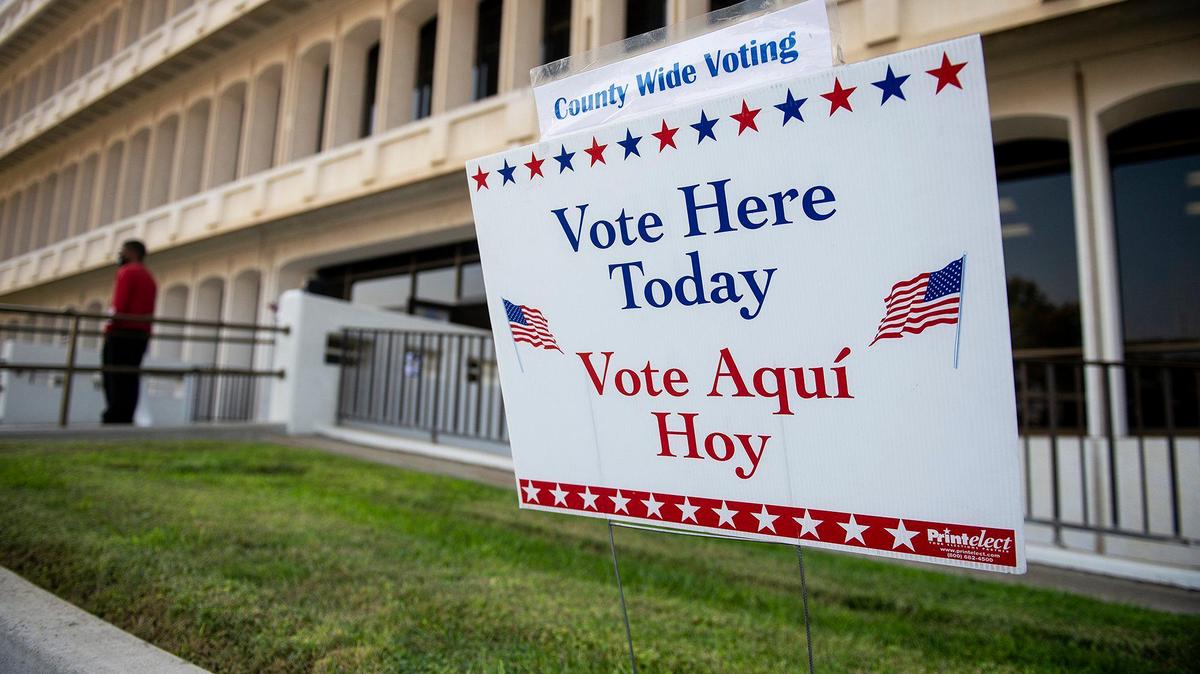 A sign directing people to vote at the location is seen outside the Merced County Building on M Street in Merced, Calif., on Tuesday, Nov. 3, 2020.