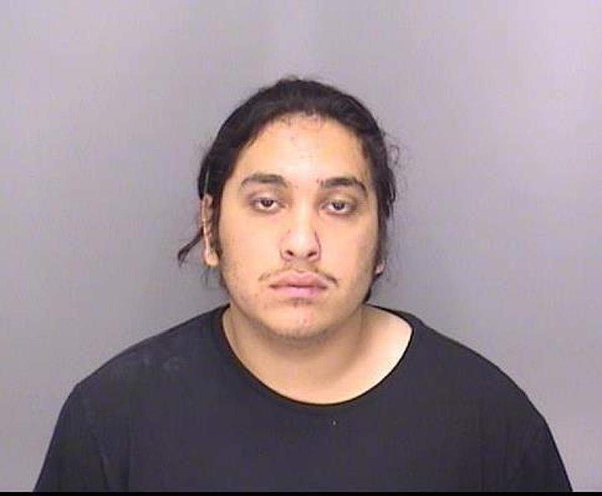 Nineteen-year-old Jesus Tapia from Palo Alto, shown in this booking photo, and 19-year-old Francisco Cruz from Patterson, were arrested Thursday night after illegally possessing guns and leading police on a pursuit that spanned Merced County, according to Merced police.