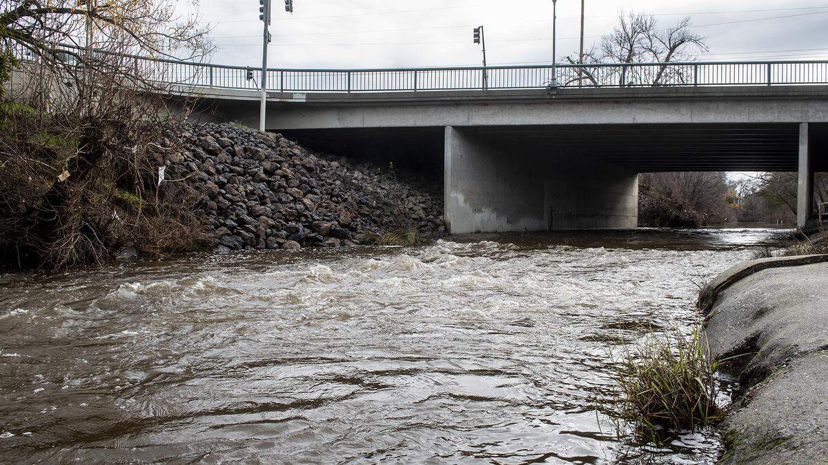 Bear Creek flows beneath G Street and along the Michael O. Sullivan Bike Path in Merced, Calif., on Wednesday, Jan. 4, 2023.