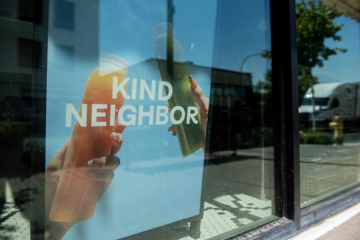 Signage for Kind Neighbor, a Merced juice bar, is seen in the windows at 1717 M Street in Merced, Calif., on Monday, Aug. 25, 2025. The juice bar will be reopening in the new location in September. 