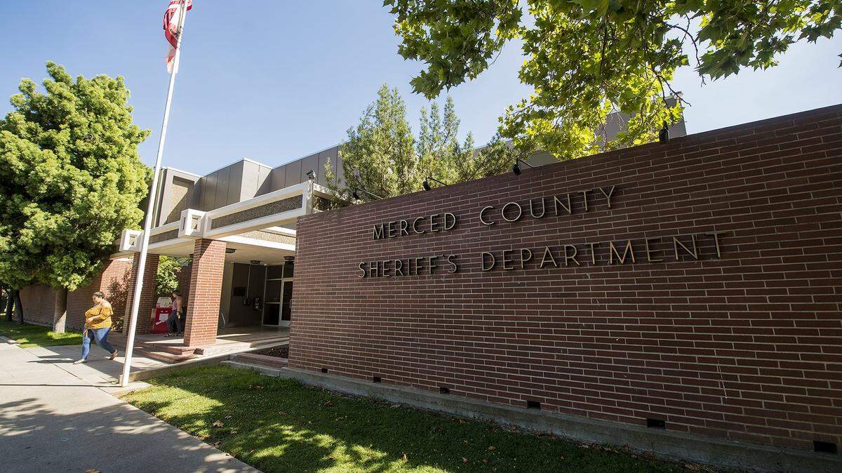 People exit the Merced County Sheriff’s Department building located at 700 West 22nd Street in Merced, Calif. The location is also home to the Merced County Jail.