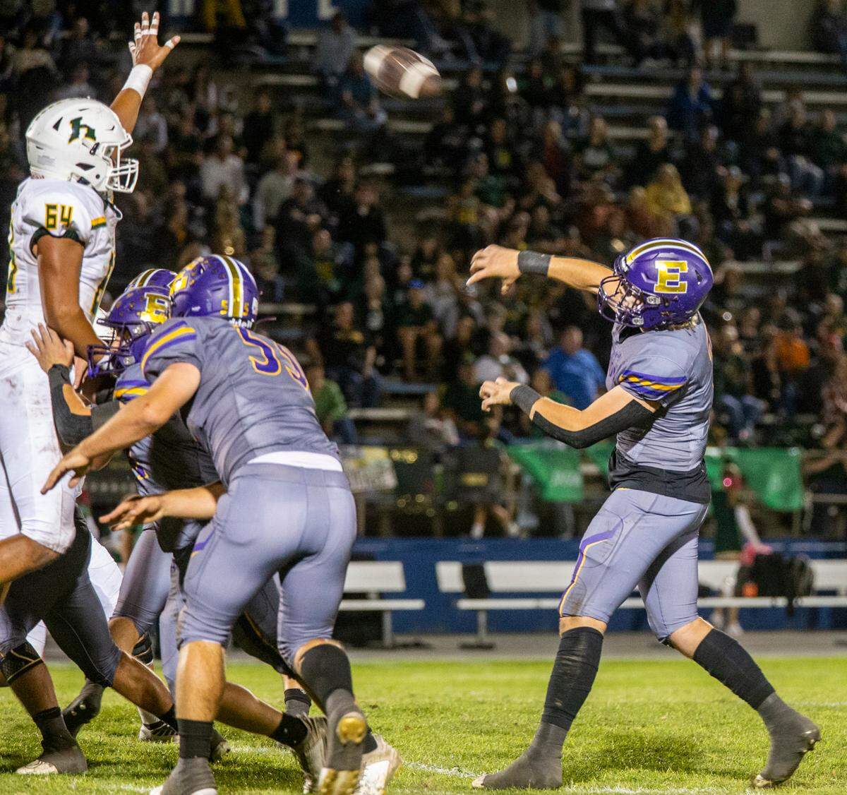 Donovan Rozevink, 7, of Escalon High throws a pass over the d-line of Hilmar High Friday Oct. 13, 2023 night.