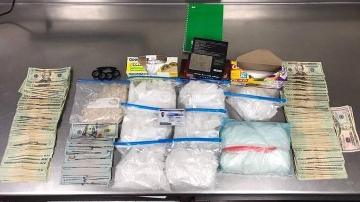 Merced police say they found packaged methamphetamine, packaging materials, metal knuckles, ammunition and over $12,000 in cash during a search of an Atwater residence on Dec. 8, 2018. Photo courtesy of the Merced Police Department.