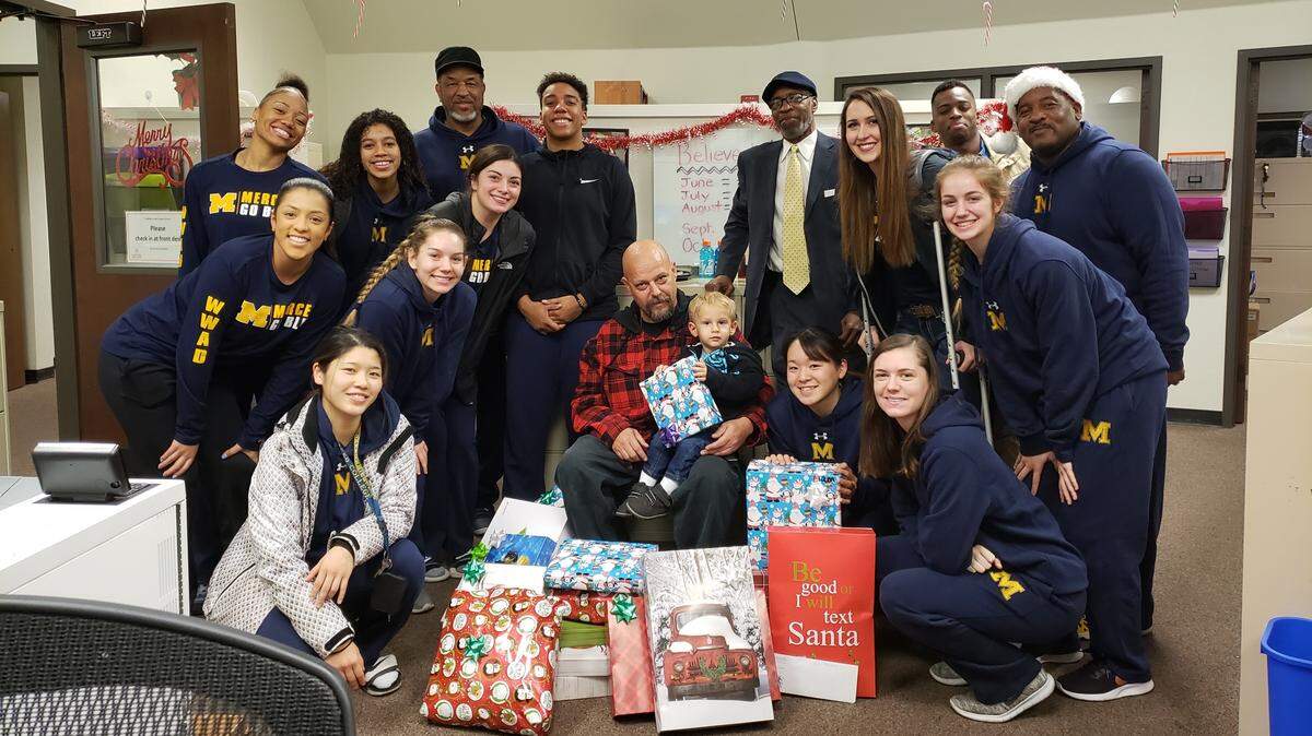 Jason Cincotta and his two sons were the beneficiaries of the good will this year, receiving an abundance of gifts from the women’s basketball team on Friday morning.