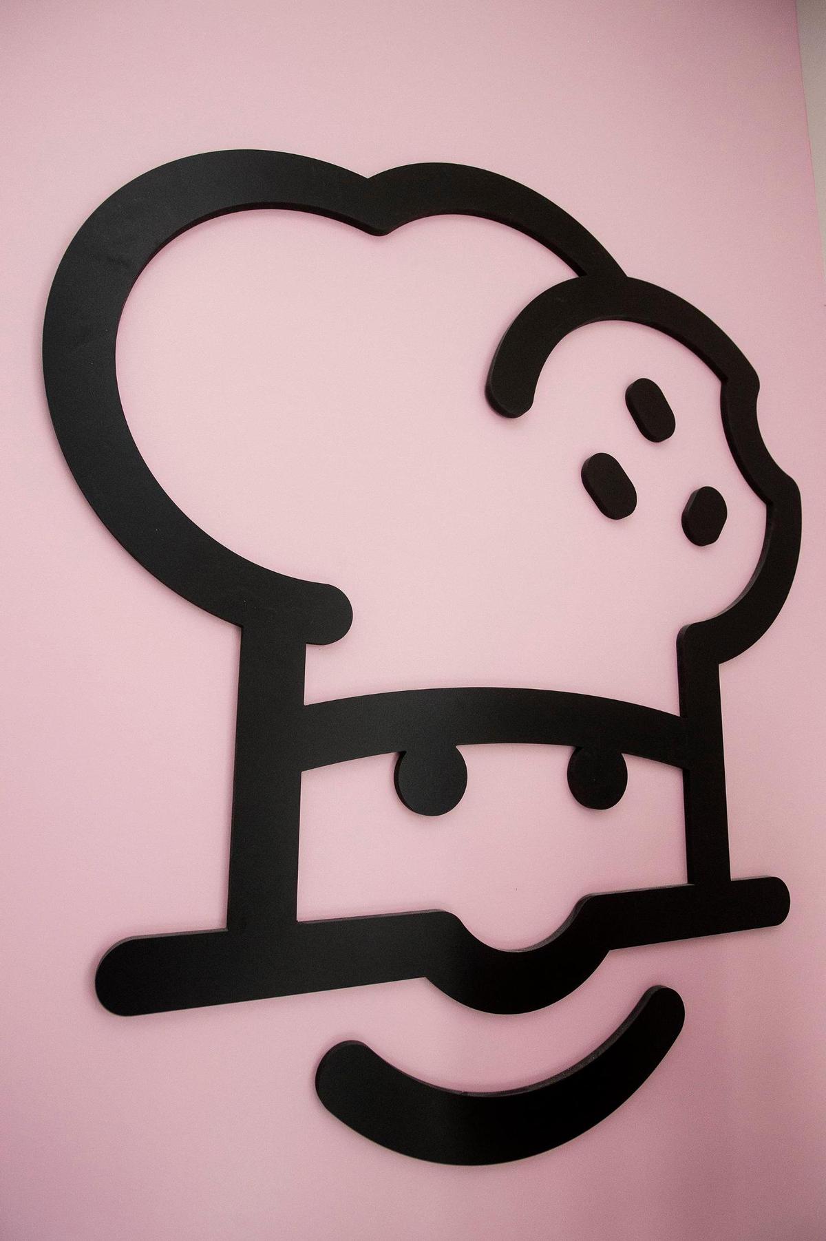 A Crumbl Cookies logo inside the new location at 3630 G Street, Suite E, in the new Yosemite Crossing shopping center in Merced, Calif., on Wednesday, June 7, 2023. The location’s grand opening is scheduled for June 9.