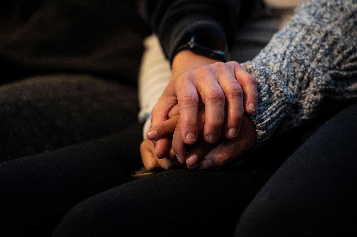 Family members hold hands as they speak about Billie Edwards, 73, and Carolyn Rose, 76, in Atwater, Calif., on Thursday, Nov. 3, 2022. The family said Edwards and Rose were walking along East Juniper Avenue on Nov. 2, when they were struck and killed by a vehicle. Authorities said the vehicle was traveling westbound on East Juniper Avenue when it left the roadway striking the women and a light pole.