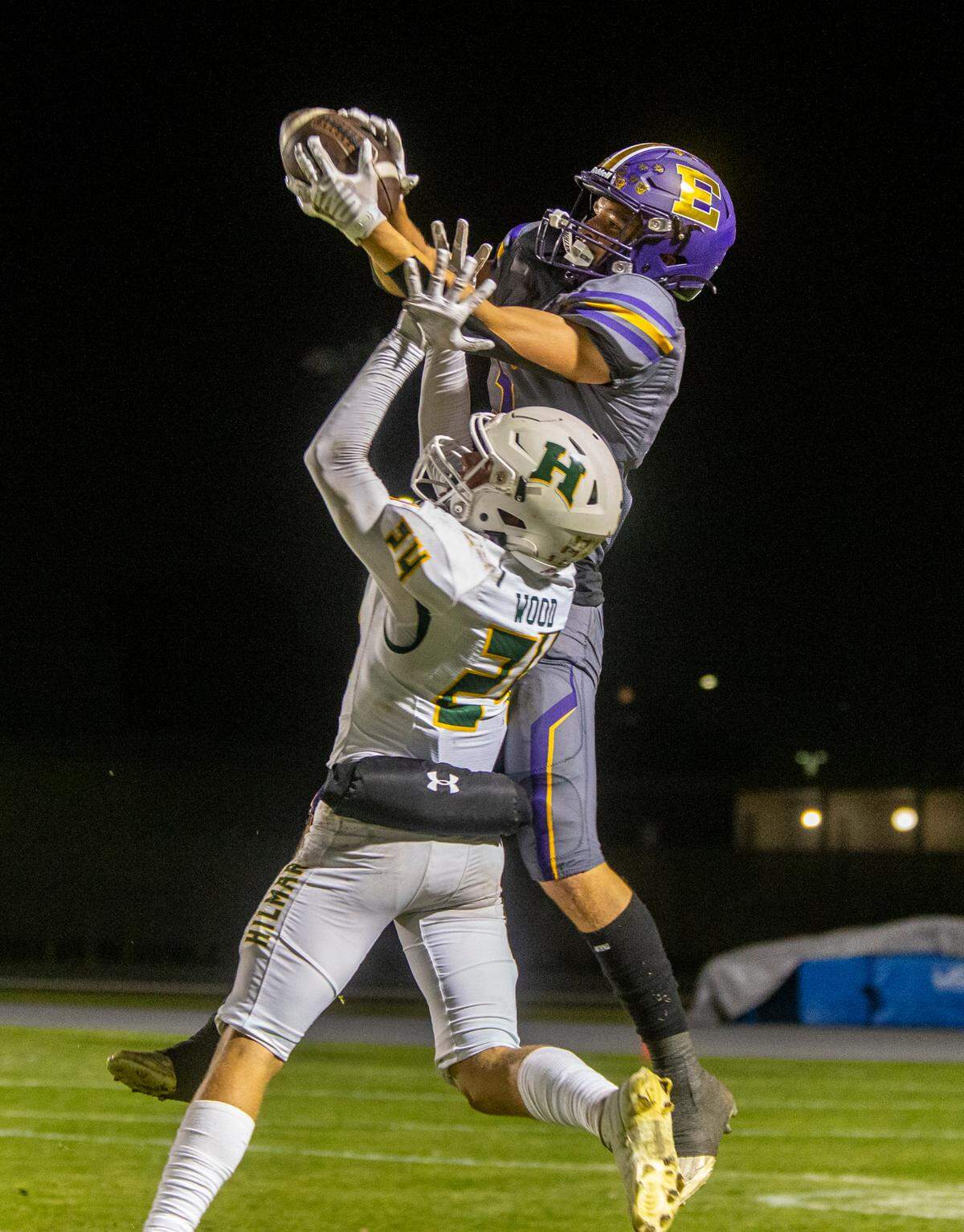 Sam Jimenez, 5, of Escalon High grabs a pass over Caden Wood, 24, of Hilmar High Friday Oct. 13, 2023.