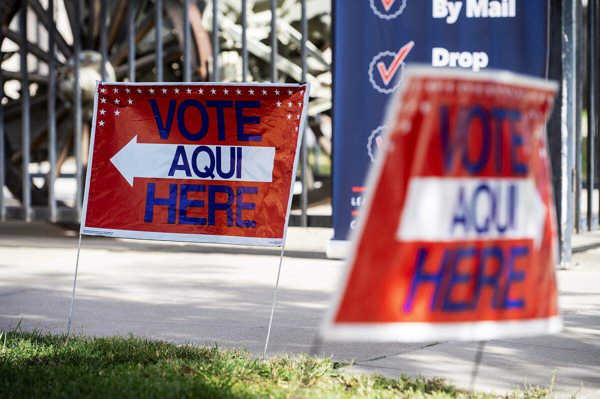 Signs indicating where to vote outside the Veterans Memorial Building in Merced, Calif., on Tuesday, Nov. 5, 2024. 