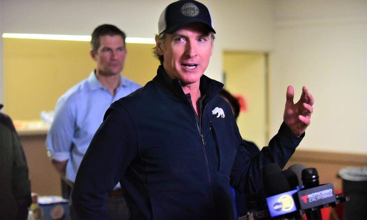 Governor Gavin Newsom speaks to reporters about the recent storms and flooding to hit Merced County during a press conference on Saturday, Jan. 14, 2023 at an evacuation center set up at the Merced County Fairgrounds in Merced, Calf.