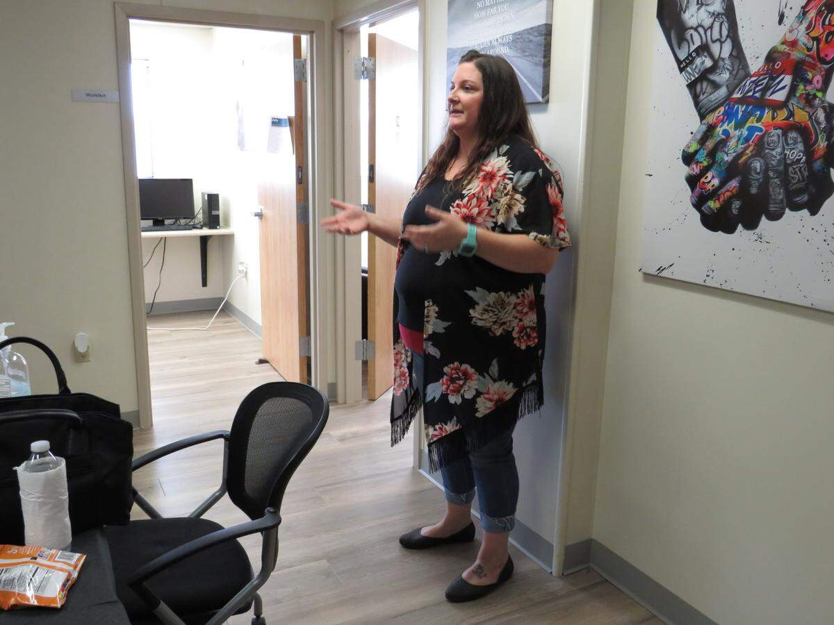 Tristin Gresham, probation program specialist for Breaking Barriers, explains the purpose and mission of the program at the program’s first open house Friday, July 23, 2021 in Los Banos, California.