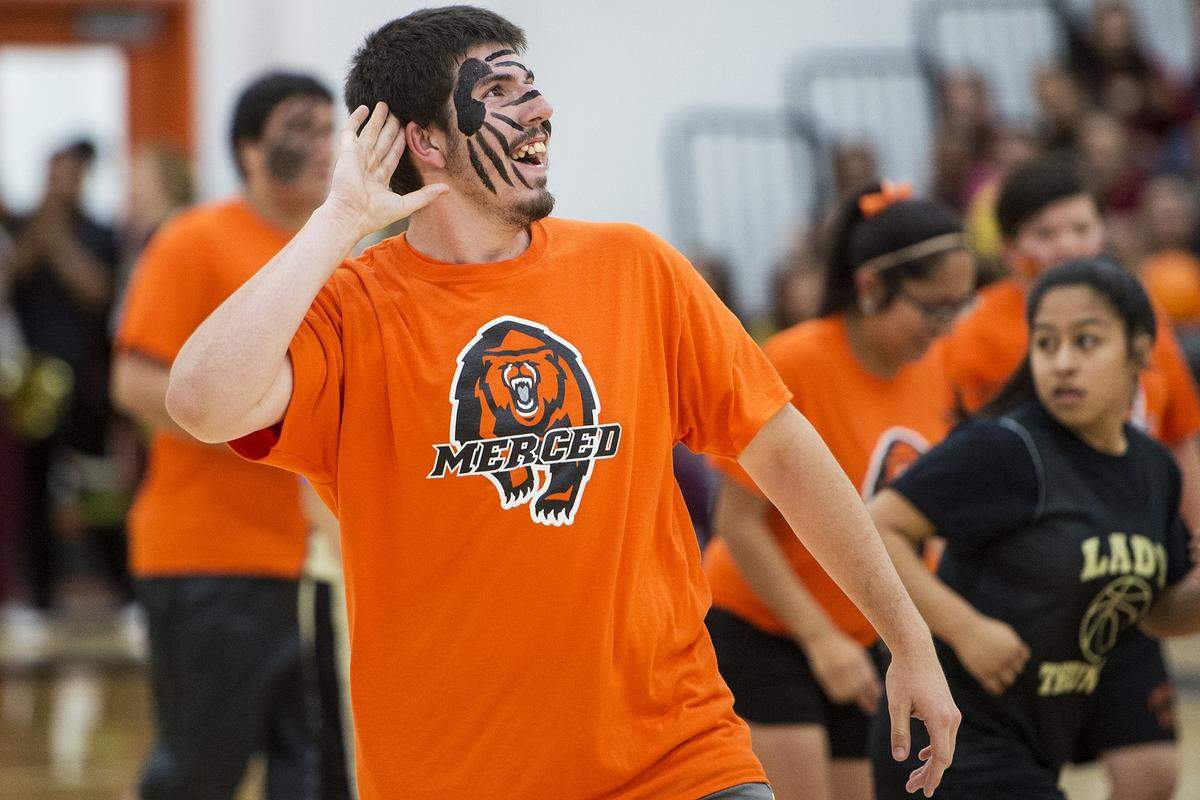 Merced High’s Bruce Smith plays to the crowd while celebrating after making a 3-pointer during a unified basketball game at Merced High School in Merced, Calif., on Friday, March 16, 2018. Smith, who has been team manager for the Bears football team,  got to see his first action on the field during the Bears’ 59-19 win over Atwater on Oct. 19, 2018.