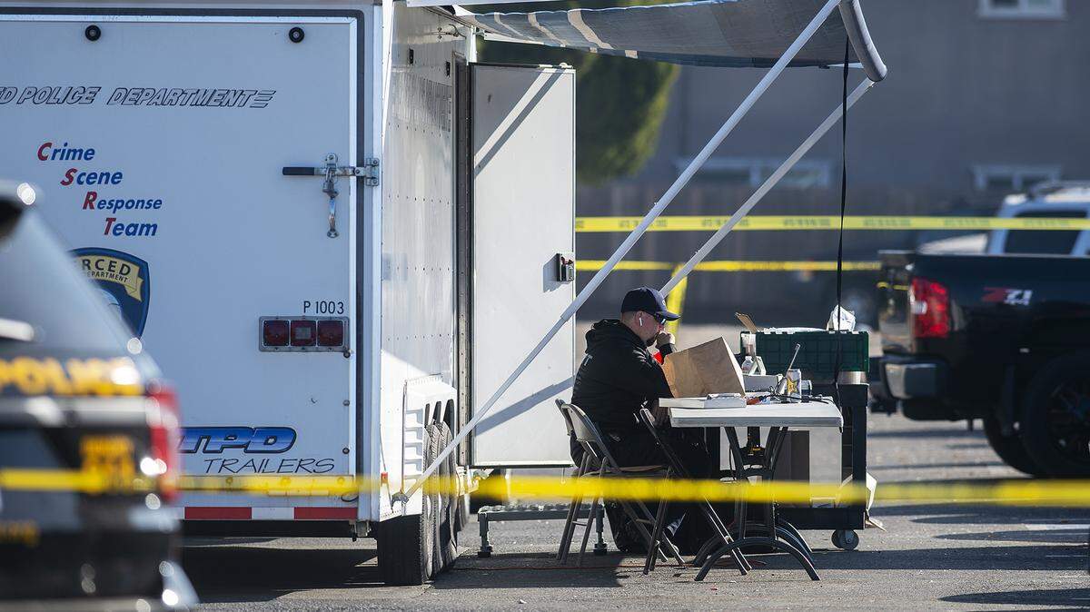 The Merced Police Department investigates a shooting that killed one person and injured two others at an apartment complex near the northeast corner of Glen Avenue and East Santa Fe Avenue in Merced, Calif., on Wednesday, Dec. 2, 2020.