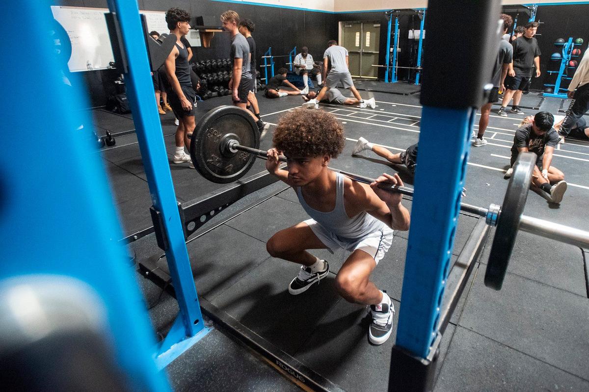 El Capitan senior football player Elias Ruiz, 17, works out with teammates at El Capitan High School in Merced, Calif., on Thursday, Sept. 5, 2024.
